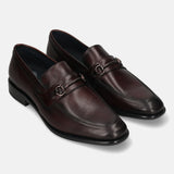 A grey Men's bugatti Bit Loafer featuring a round toe apron toe, stacked heel. Made from premium genuine leather with a durable leather outsole, this slip-on design offers both style and comfort.
