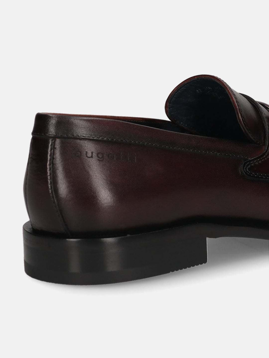 A grey Men's bugatti Bit Loafer featuring a round toe apron toe, stacked heel. Made from premium genuine leather with a durable leather outsole, this slip-on design offers both style and comfort.