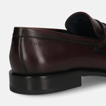 A grey Men's bugatti Bit Loafer featuring a round toe apron toe, stacked heel. Made from premium genuine leather with a durable leather outsole, this slip-on design offers both style and comfort.