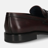 A grey Men's bugatti Bit Loafer featuring a round toe apron toe, stacked heel. Made from premium genuine leather with a durable leather outsole, this slip-on design offers both style and comfort.