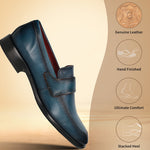 A blue Men's bugatti Penny Loafer featuring a round toe apron toe, stacked heel. Made from premium genuine leather with a durable leather outsole, this slip-on design offers both style and comfort.