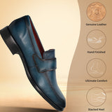 A blue Men's bugatti Penny Loafer featuring a round toe apron toe, stacked heel. Made from premium genuine leather with a durable leather outsole, this slip-on design offers both style and comfort.