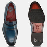 A blue Men's bugatti Penny Loafer featuring a round toe apron toe, stacked heel. Made from premium genuine leather with a durable leather outsole, this slip-on design offers both style and comfort.