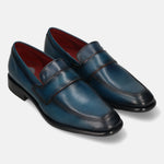 A blue Men's bugatti Penny Loafer featuring a round toe apron toe, stacked heel. Made from premium genuine leather with a durable leather outsole, this slip-on design offers both style and comfort.
