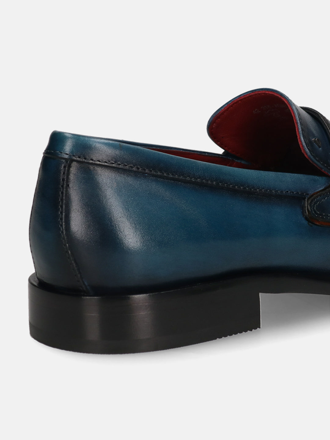 A blue Men's bugatti Penny Loafer featuring a round toe apron toe, stacked heel. Made from premium genuine leather with a durable leather outsole, this slip-on design offers both style and comfort.
