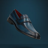 A blue Men's bugatti Penny Loafer featuring a round toe apron toe, stacked heel. Made from premium genuine leather with a durable leather outsole, this slip-on design offers both style and comfort.