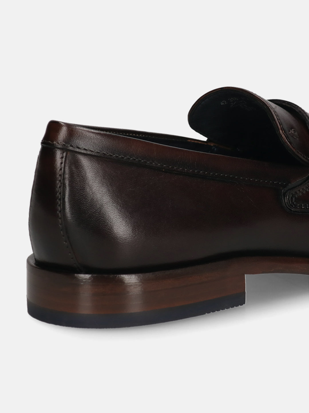 A brown Men's bugatti Penny Loafer featuring a round toe apron toe, stacked heel. Made from premium genuine leather with a durable leather outsole, this slip-on design offers both style and comfort.