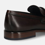 A brown Men's bugatti Penny Loafer featuring a round toe apron toe, stacked heel. Made from premium genuine leather with a durable leather outsole, this slip-on design offers both style and comfort.