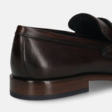 A brown Men's bugatti Penny Loafer featuring a round toe apron toe, stacked heel. Made from premium genuine leather with a durable leather outsole, this slip-on design offers both style and comfort.