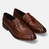 A cognac Men's bugatti Penny Loafer featuring a round toe apron toe, stacked heel. Made from premium genuine leather with a durable leather outsole, this slip-on design offers both style and comfort.