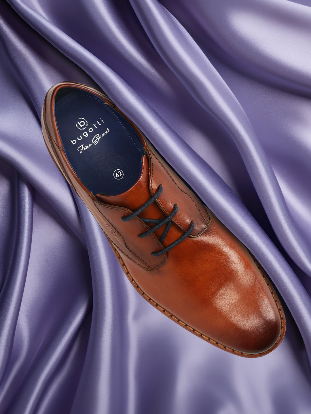 A cognac Men's bugatti Derby featuring a round toe plain toe, stacked heel. Made from premium genuine leather with a durable eva outsole, this laces design offers both style and comfort.