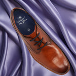 A cognac Men's bugatti Derby featuring a round toe plain toe, stacked heel. Made from premium genuine leather with a durable eva outsole, this laces design offers both style and comfort.