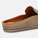 A beige Men's bugatti Mules featuring a square toe apron toe, zero heels heel. Made from premium genuine leather with a durable tpr outsole, this slip-on design offers both style and comfort.