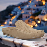 A beige Men's bugatti Mules featuring a square toe apron toe, zero heels heel. Made from premium genuine leather with a durable tpr outsole, this slip-on design offers both style and comfort.