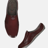 A grey Men's bugatti Mules featuring a round toe plain toe, zero heels heel. Made from premium genuine leather with a durable sebs (block copolymer) outsole, this slip-on design offers both style and comfort.