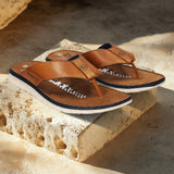 A cognac Men's bugatti Thongs featuring a round open toe, zero heels heel. Made from premium genuine leather with a durable synthetic outsole, this slip-on design offers both style and comfort.