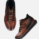 A brown Men's bugatti Sneakers featuring a round toe plain toe, zero heels heel, and a wide fit. Made from premium genuine leather with a durable tpr outsole, this zipper design offers both style and comfort.