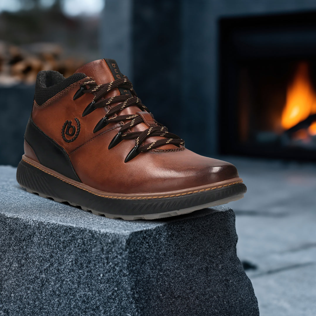 A brown Men's bugatti Sneakers featuring a round toe plain toe, zero heels heel, and a wide fit. Made from premium genuine leather with a durable tpr outsole, this zipper design offers both style and comfort.