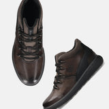 A grey Men's bugatti Sneakers featuring a round toe plain toe, zero heels heel, and a wide fit. Made from premium genuine leather with a durable tpr outsole, this zipper design offers both style and comfort.