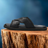 A black Men's bugatti Mules featuring a round toe plain toe, zero heels heel, and a wide fit. Made from premium genuine leather with a durable eva outsole, this slip-on design offers both style and comfort.