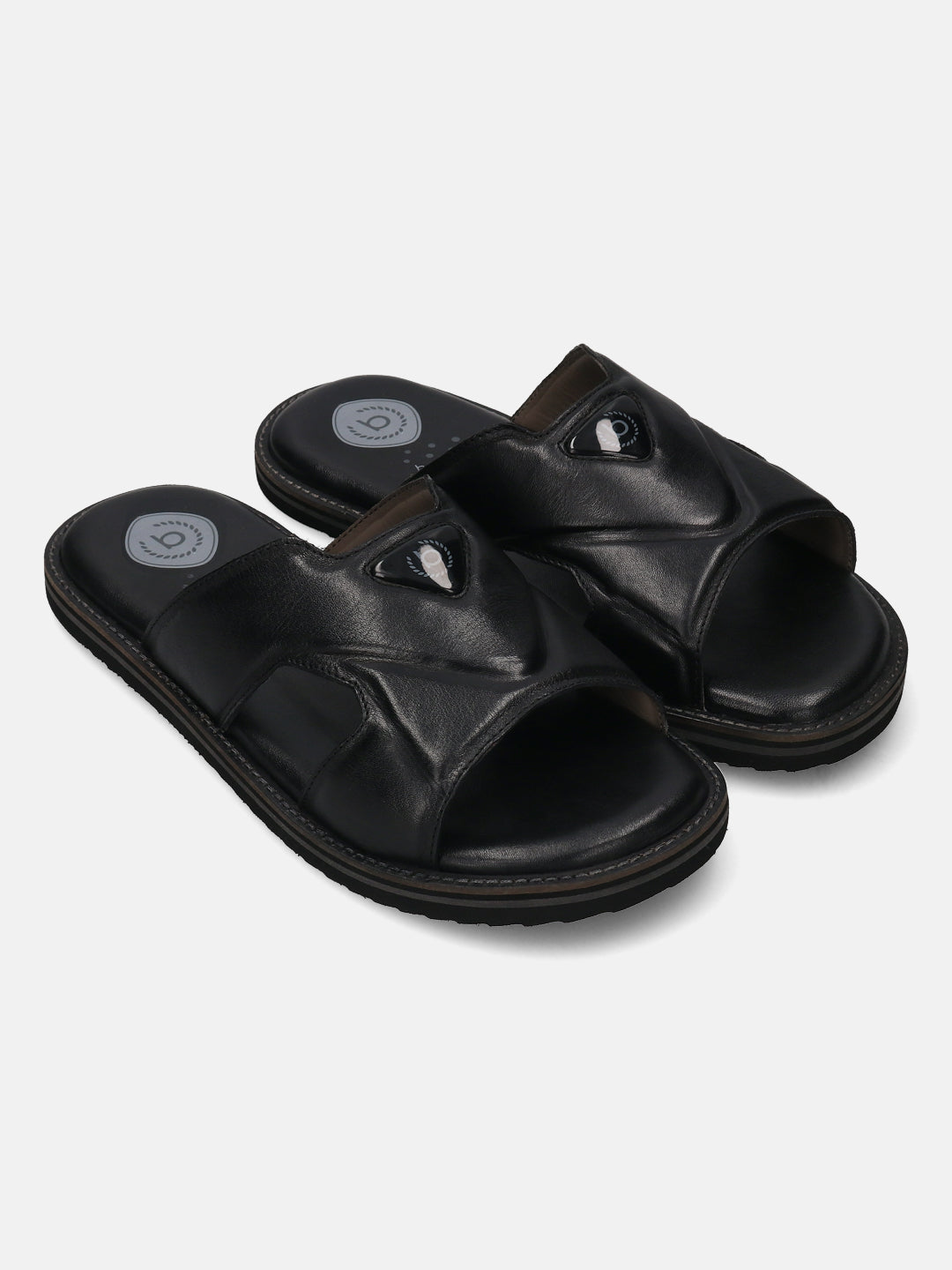 A black Men's bugatti Mules featuring a round toe plain toe, zero heels heel, and a wide fit. Made from premium genuine leather with a durable eva outsole, this slip-on design offers both style and comfort.