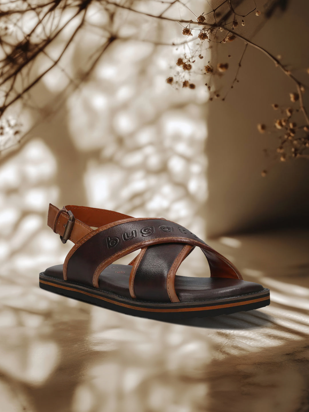 A brown Men's bugatti Back Strap Sandals featuring a open toe plain toe, zero heels heel, and a wide fit. Made from premium genuine leather with a durable eva outsole, this buckle design offers both style and comfort.