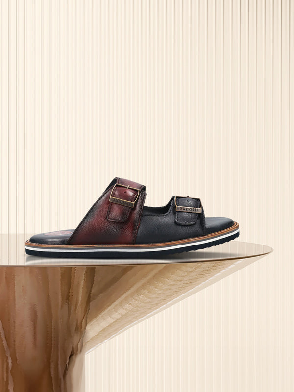 A blue Men's bugatti Mules featuring a round toe plain toe, zero heels heel. Made from premium genuine leather with a durable eva outsole, this slip-on design offers both style and comfort.