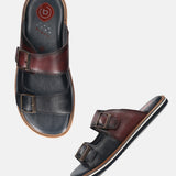 A blue Men's bugatti Mules featuring a round toe plain toe, zero heels heel. Made from premium genuine leather with a durable eva outsole, this slip-on design offers both style and comfort.
