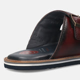 A blue Men's bugatti Mules featuring a round toe plain toe, zero heels heel. Made from premium genuine leather with a durable eva outsole, this slip-on design offers both style and comfort.