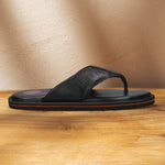 A black Men's bugatti Thongs featuring a open toe plain toe, zero heels heel, and a wide fit. Made from premium genuine leather with a durable eva outsole, this slip-on design offers both style and comfort.