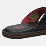 A black Men's bugatti Thongs featuring a open toe plain toe, zero heels heel, and a wide fit. Made from premium genuine leather with a durable eva outsole, this slip-on design offers both style and comfort.