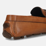 Men's Bugatti drivers cognac leather shoes with a round toe and apron toe , a rubber outsole.