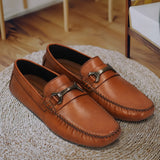 Men's Bugatti drivers cognac leather shoes with a round toe and apron toe , a rubber outsole.