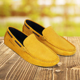 A yellow Men's bugatti Drivers featuring a square toe apron toe, zero heels heel. Made from premium genuine leather with a durable pu outsole, this slip-on design offers both style and comfort.