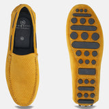 A yellow Men's bugatti Drivers featuring a square toe apron toe, zero heels heel. Made from premium genuine leather with a durable pu outsole, this slip-on design offers both style and comfort.