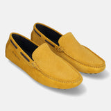 A yellow Men's bugatti Drivers featuring a square toe apron toe, zero heels heel. Made from premium genuine leather with a durable pu outsole, this slip-on design offers both style and comfort.