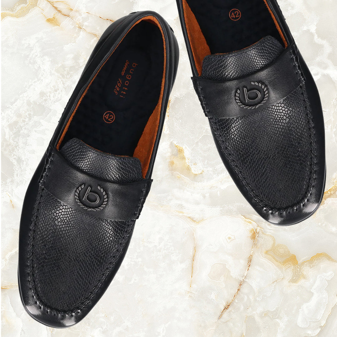 A blue Men's bugatti Drivers featuring a round toe apron toe, zero heels heel. Made from premium genuine leather with a durable rubber outsole, this slip-on design offers both style and comfort.