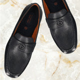 A blue Men's bugatti Drivers featuring a round toe apron toe, zero heels heel. Made from premium genuine leather with a durable rubber outsole, this slip-on design offers both style and comfort.