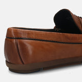 A cognac Men's bugatti Drivers featuring a round toe apron toe, zero heels heel. Made from premium genuine leather with a durable rubber outsole, this slip-on design offers both style and comfort.