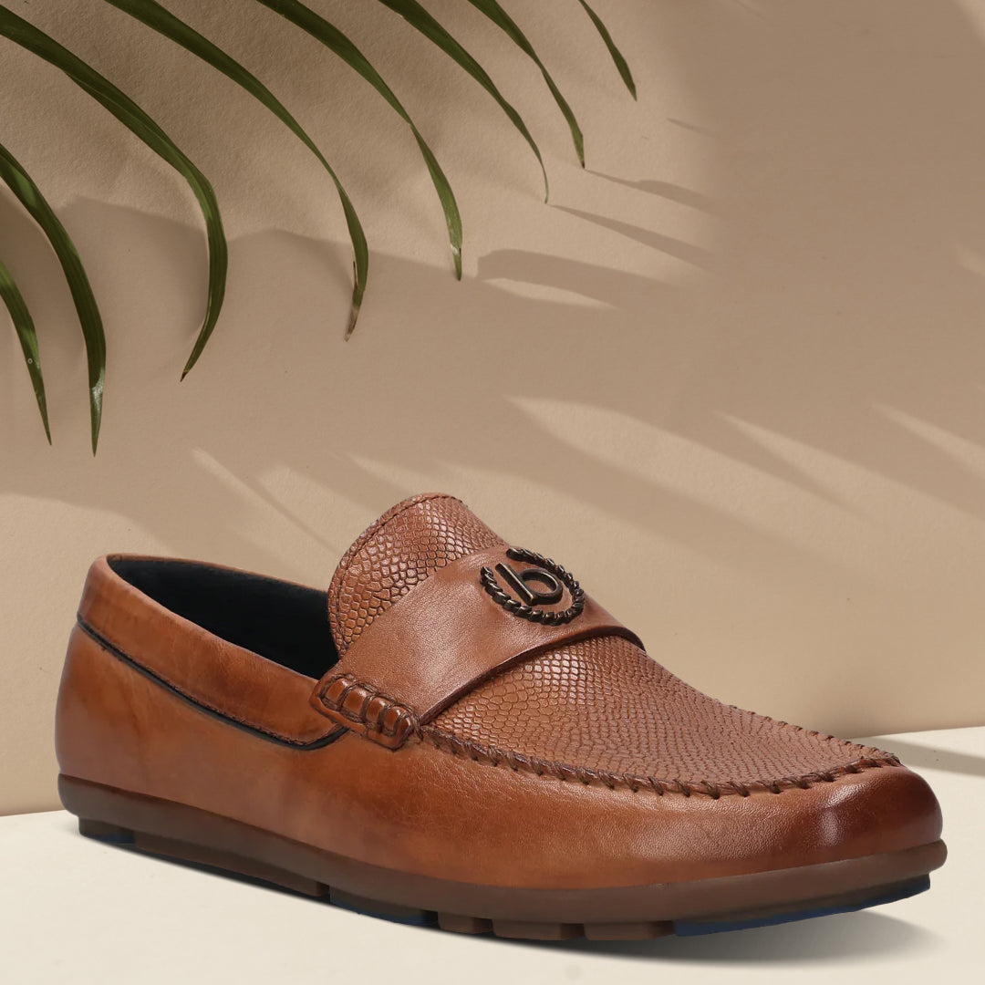 A cognac Men's bugatti Drivers featuring a round toe apron toe, zero heels heel. Made from premium genuine leather with a durable rubber outsole, this slip-on design offers both style and comfort.