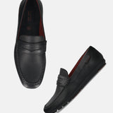 A black Men's bugatti Drivers featuring a round toe apron toe, zero heels heel. Made from premium genuine leather with a durable rubber outsole, this slip-on design offers both style and comfort.