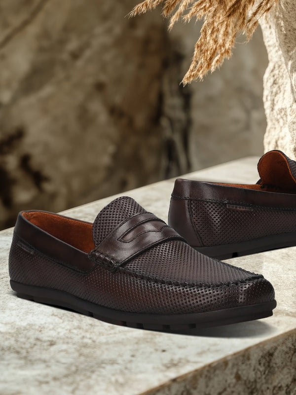 A brown Men's bugatti Drivers featuring a round toe apron toe, zero heels heel. Made from premium genuine leather with a durable rubber outsole, this slip-on design offers both style and comfort.