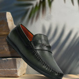 Men's Bugatti drivers green leather shoes with a round toe and apron toe , a tpr outsole.