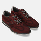 A grey Men's bugatti Casuals Shoes featuring a round toe wing tip, zero heels heel, and a wide fit. Made from premium genuine leather with a durable tr outsole, this laces design offers both style and comfort.