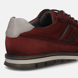 A grey Men's bugatti Casuals Shoes featuring a round toe wing tip, zero heels heel, and a wide fit. Made from premium genuine leather with a durable tr outsole, this laces design offers both style and comfort.