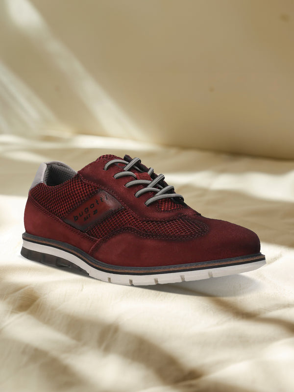 A grey Men's bugatti Casuals Shoes featuring a round toe wing tip, zero heels heel, and a wide fit. Made from premium genuine leather with a durable tr outsole, this laces design offers both style and comfort.