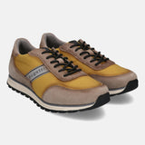 A yellow Men's bugatti Sneakers featuring a round plain toe, zero heels heel. Made from suede leather with a durable tpr outsole, this laces design offers both style and comfort.