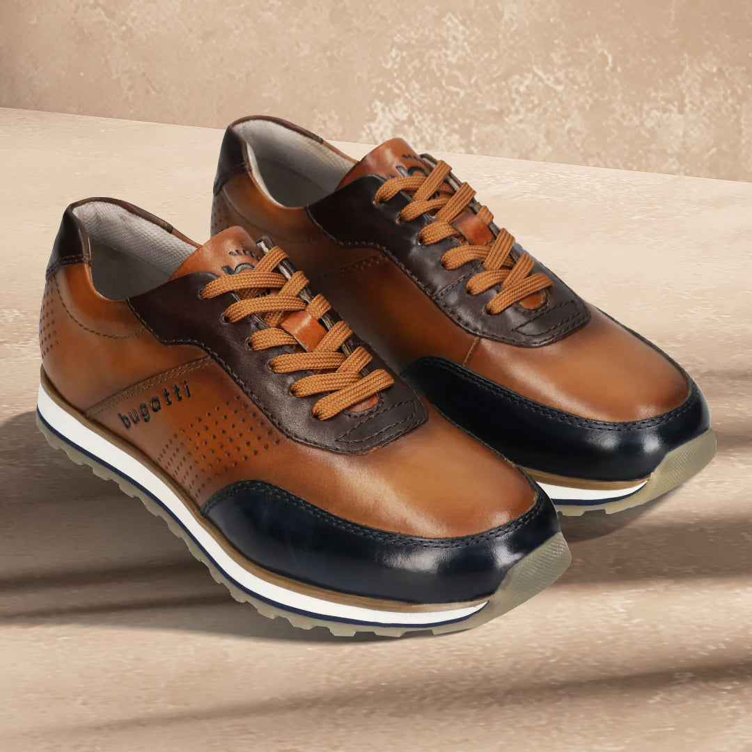 A blue Men's bugatti Sneakers featuring a round toe plain toe, zero heels heel. Made from premium genuine leather with a durable eva outsole, this laces design offers both style and comfort.