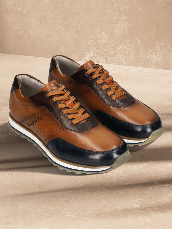 A blue Men's bugatti Sneakers featuring a round toe plain toe, zero heels heel. Made from premium genuine leather with a durable eva outsole, this laces design offers both style and comfort.