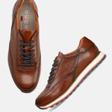 A cognac Men's bugatti Sneakers featuring a round toe plain toe, zero heels heel. Made from premium genuine leather with a durable eva outsole, this laces design offers both style and comfort.